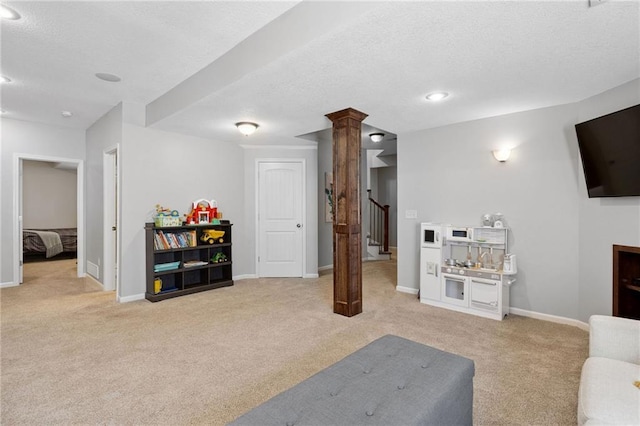 14920 S Roxburghe St, Olathe, KS 66061 - living area with light carpet, a textured ceiling, decorative columns, stairs, and recessed lighting