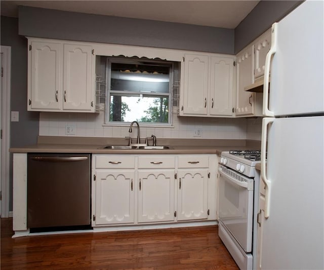 19707 E 14th St, Independence, MO 64056 - kitchen with white appliances, white cabinetry, under cabinet range hood, dark wood-style flooring, and tasteful backsplash