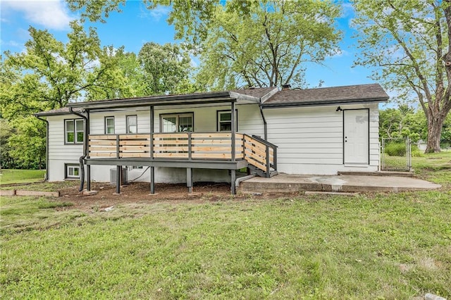 7909 Arnote Rd, Pleasant Valley, MO 64068 - back of house with a yard and a wooden deck