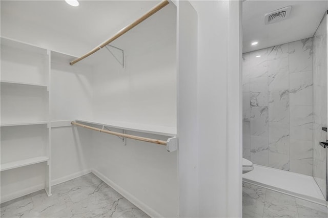 7909 Arnote Rd, Pleasant Valley, MO 64068 - walk in closet featuring marble look tile flooring
