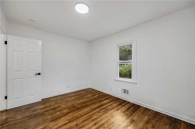 7909 Arnote Rd, Pleasant Valley, MO 64068 - empty room with baseboards and dark wood-style flooring