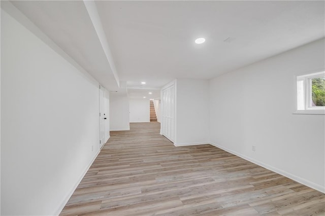 7909 Arnote Rd, Pleasant Valley, MO 64068 - spare room featuring stairway, light wood-style floors, and recessed lighting