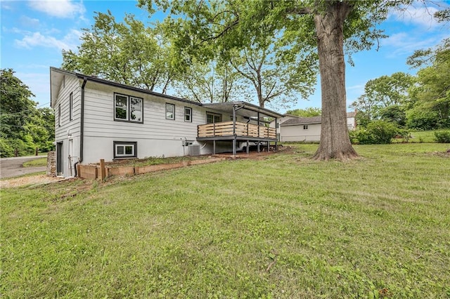 7909 Arnote Rd, Pleasant Valley, MO 64068 - back of property with a yard and a wooden deck