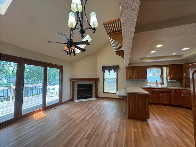 1103 SW Stonecreek Dr, Blue Springs, MO 64015 - kitchen with light countertops, light wood finished floors, a ceiling fan, backsplash, and recessed lighting