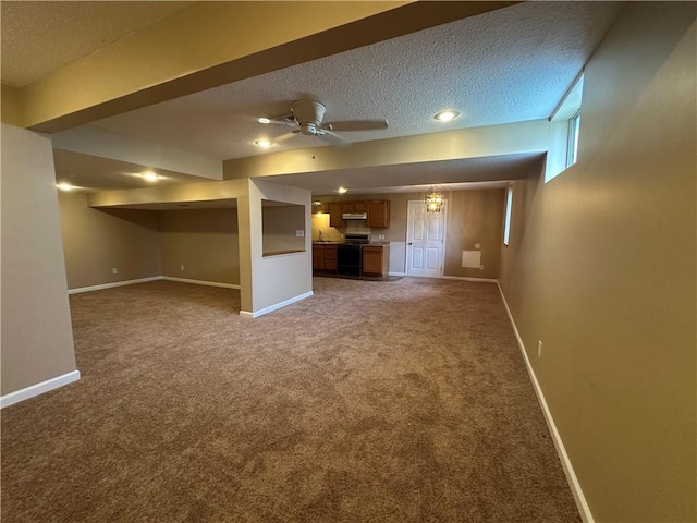 1103 SW Stonecreek Dr, Blue Springs, MO 64015 - unfurnished living room with carpet, a textured ceiling, a ceiling fan, and recessed lighting