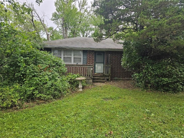 16210 Baxter Rd, Excelsior Springs, MO 64024 - view of front facade with brick siding and a front lawn