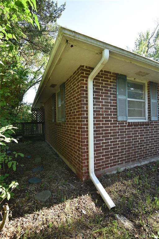 16210 Baxter Rd, Excelsior Springs, MO 64024 - view of side of property with brick siding