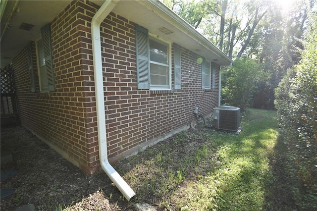 16210 Baxter Rd, Excelsior Springs, MO 64024 - view of side of home featuring a central air condition unit and brick siding