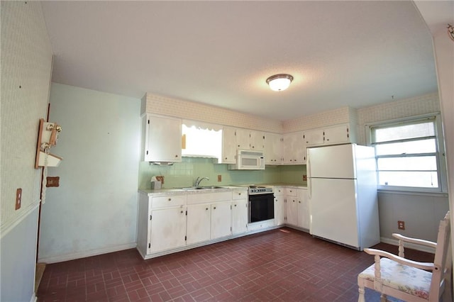 16210 Baxter Rd, Excelsior Springs, MO 64024 - kitchen with white appliances, brick patterned flooring, light countertops, and white cabinetry