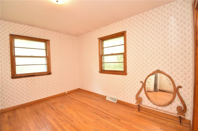 16210 Baxter Rd, Excelsior Springs, MO 64024 - unfurnished room featuring light wood finished floors and baseboards