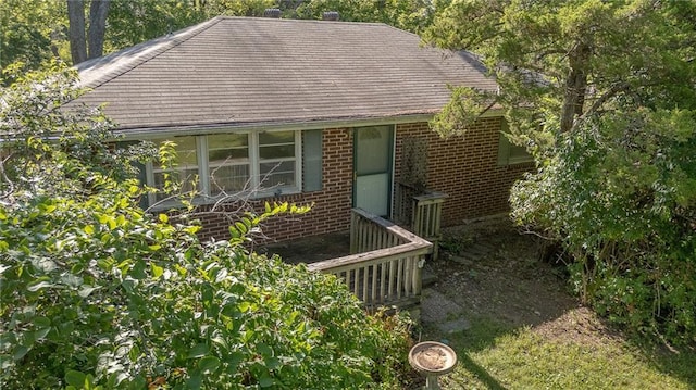 16210 Baxter Rd, Excelsior Springs, MO 64024 - view of front facade with brick siding and roof with shingles