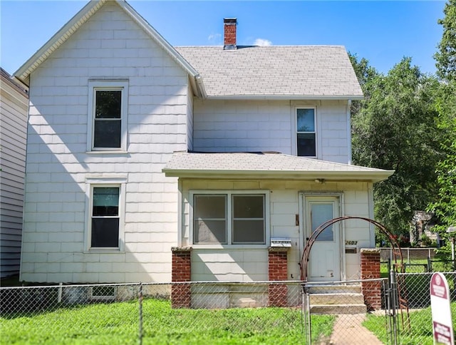 2603 Patee St, Saint Joseph, MO 64507 - view of front of home with a fenced front yard, a chimney, a shingled roof, and a gate