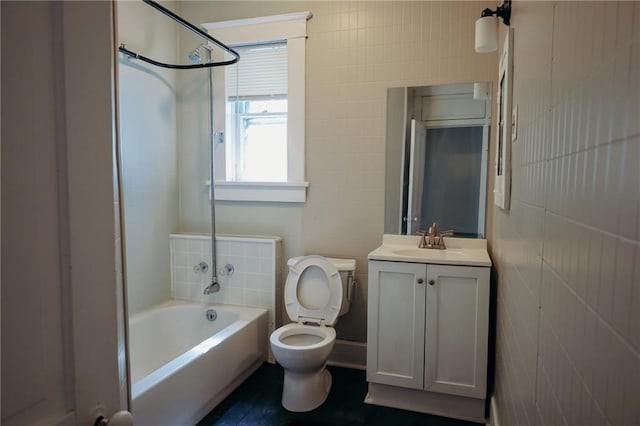 2603 Patee St, Saint Joseph, MO 64507 - bathroom featuring vanity, tile walls, and bathing tub / shower combination