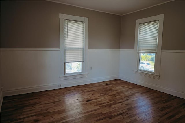 2603 Patee St, Saint Joseph, MO 64507 - unfurnished room featuring wainscoting, wood finished floors, ornamental molding, and plenty of natural light