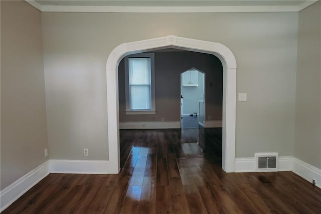 2603 Patee St, Saint Joseph, MO 64507 - empty room featuring dark wood-style floors and arched walkways