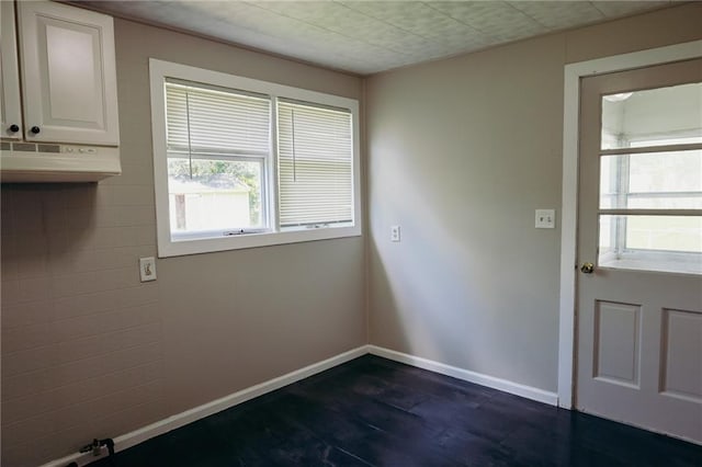 2603 Patee St, Saint Joseph, MO 64507 - doorway to outside with dark wood-style flooring and baseboards