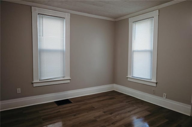 2603 Patee St, Saint Joseph, MO 64507 - unfurnished room with dark wood-style flooring, plenty of natural light, and crown molding
