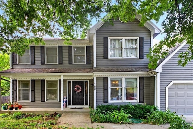 15820 W 150th Ter, Olathe, KS 66062 - view of front of house with a porch and an attached garage