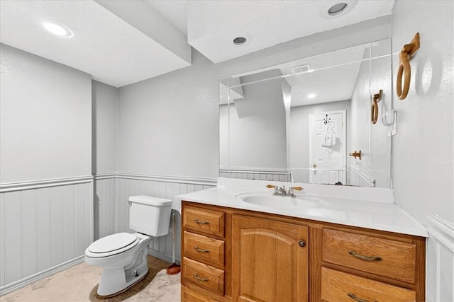 15820 W 150th Ter, Olathe, KS 66062 - bathroom featuring vanity, wainscoting, and recessed lighting