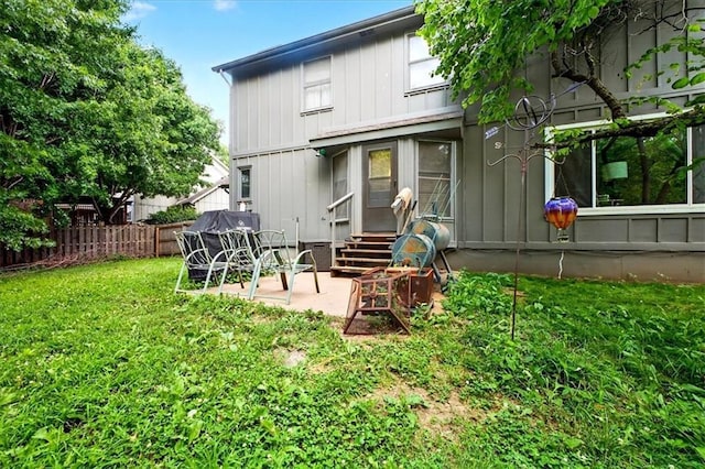 15820 W 150th Ter, Olathe, KS 66062 - rear view of property featuring entry steps, a patio area, and board and batten siding