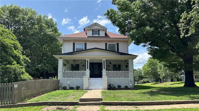 309 College St, Paola, KS 66071 - american foursquare style home featuring a porch