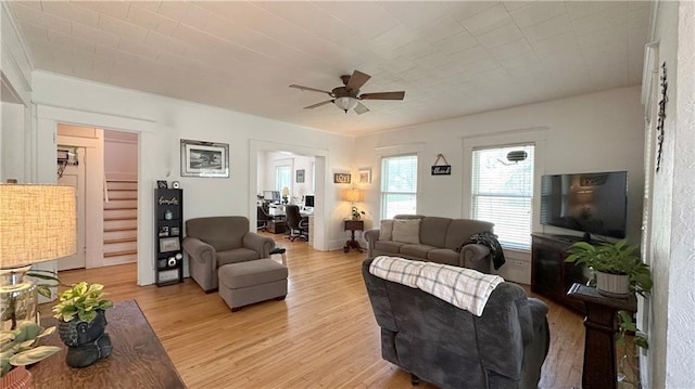 309 College St, Paola, KS 66071 - living area with a ceiling fan, light wood finished floors, and a desk