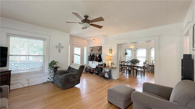 309 College St, Paola, KS 66071 - living area featuring ceiling fan and light wood-style flooring