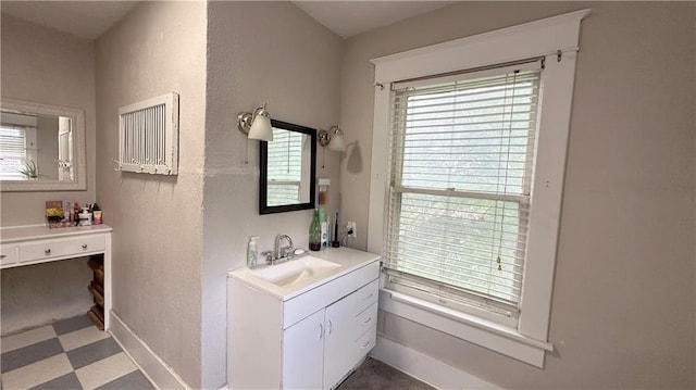 309 College St, Paola, KS 66071 - bathroom with vanity and tile patterned floors