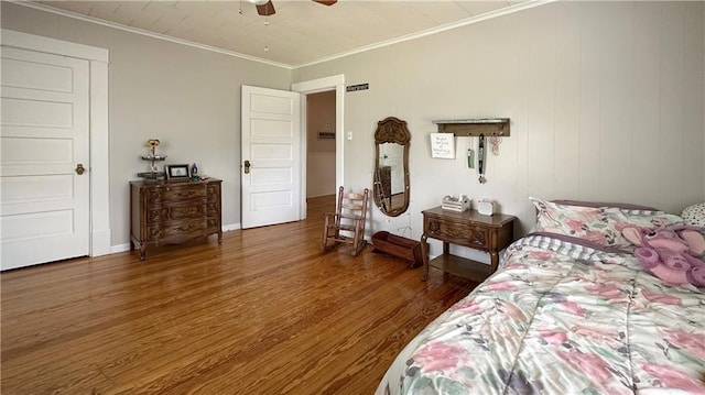 309 College St, Paola, KS 66071 - bedroom featuring wood finished floors, ornamental molding, and a ceiling fan