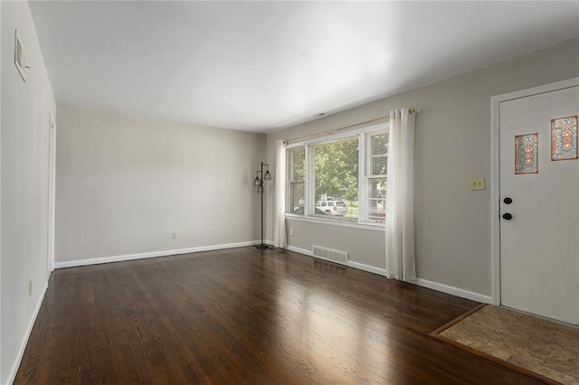 5921 Lexington Ave, Kansas City, MO 64123 - spare room with wood finished floors and baseboards