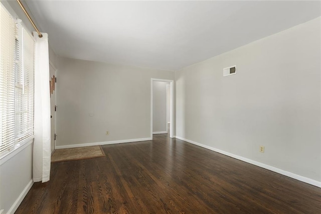 5921 Lexington Ave, Kansas City, MO 64123 - unfurnished room featuring wood finished floors and baseboards