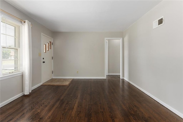 5921 Lexington Ave, Kansas City, MO 64123 - empty room with dark wood finished floors and baseboards