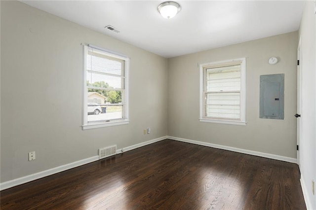 5921 Lexington Ave, Kansas City, MO 64123 - unfurnished room featuring electric panel and wood finished floors