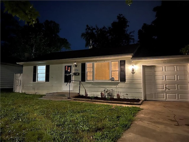 5921 Lexington Ave, Kansas City, MO 64123 - ranch-style house featuring an attached garage, driveway, and a yard