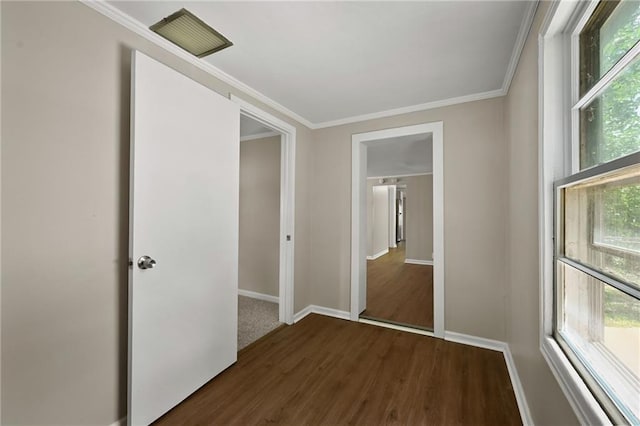 813 S Hardy Ave, Independence, MO 64053 - spare room featuring dark wood-style floors and ornamental molding