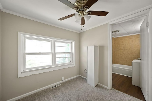 813 S Hardy Ave, Independence, MO 64053 - unfurnished bedroom featuring ornamental molding, carpet flooring, and ceiling fan