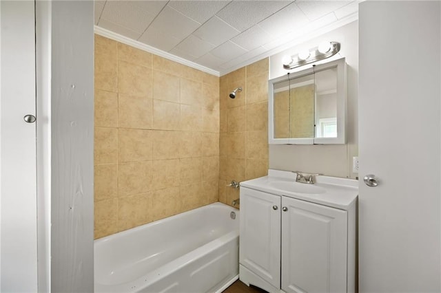 813 S Hardy Ave, Independence, MO 64053 - bathroom with vanity, washtub / shower combination, and crown molding