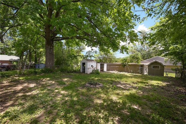 813 S Hardy Ave, Independence, MO 64053 - fenced backyard with a storage shed