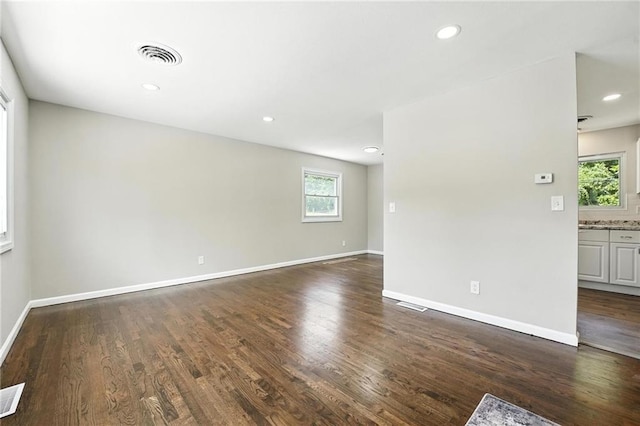 4916 N Manchester Ave, Kansas City, MO 64119 - unfurnished room featuring dark wood finished floors and recessed lighting