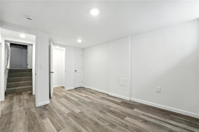 4916 N Manchester Ave, Kansas City, MO 64119 - unfurnished bedroom featuring wood finished floors and recessed lighting