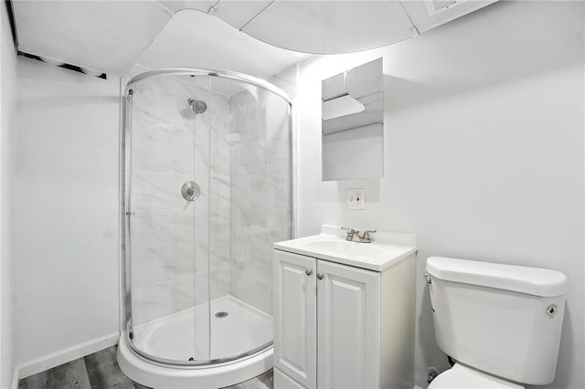 4916 N Manchester Ave, Kansas City, MO 64119 - bathroom featuring a stall shower, wood finished floors, and vanity