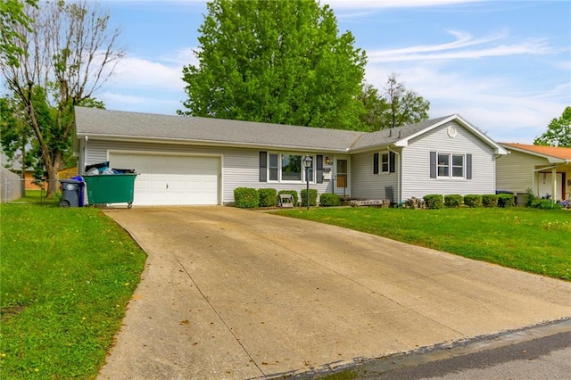 904 Leone Ave, Sedalia, MO 65301 - ranch-style home with a garage, driveway, and a front yard
