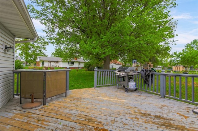 904 Leone Ave, Sedalia, MO 65301 - deck with a lawn and a grill