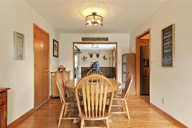 904 Leone Ave, Sedalia, MO 65301 - dining space featuring a chandelier and light wood-type flooring