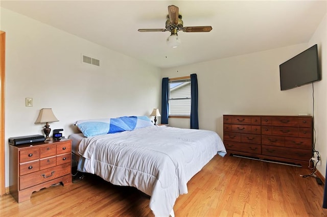904 Leone Ave, Sedalia, MO 65301 - bedroom featuring wood finished floors and a ceiling fan