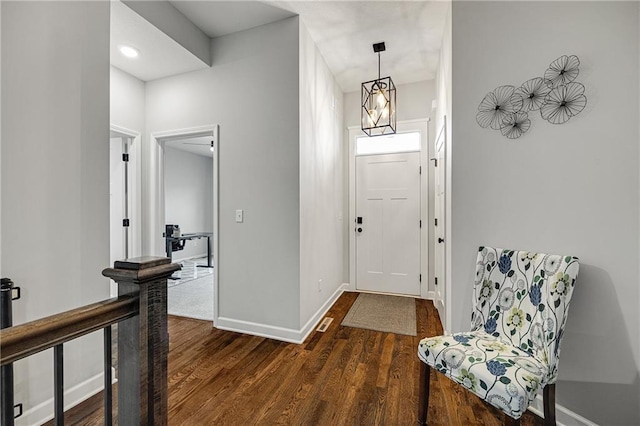 1296 NW Lindenwood Dr, Grain Valley, MO 64029 - foyer with wood finished floors and baseboards