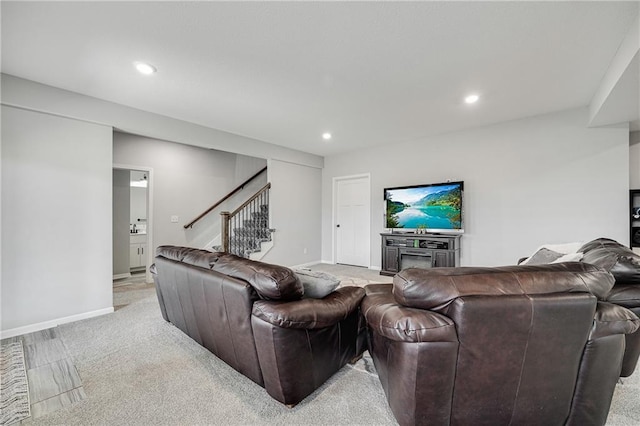 1296 NW Lindenwood Dr, Grain Valley, MO 64029 - living room with stairway, recessed lighting, and light carpet