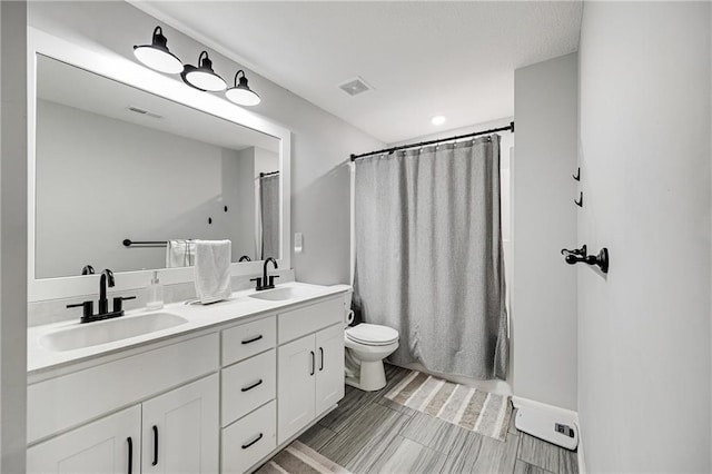1296 NW Lindenwood Dr, Grain Valley, MO 64029 - bathroom featuring double vanity and a shower with shower curtain