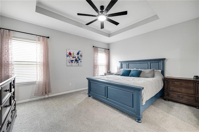 1296 NW Lindenwood Dr, Grain Valley, MO 64029 - bedroom featuring a raised ceiling, light carpet, ceiling fan, and ornamental molding