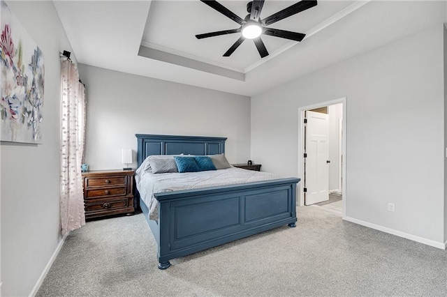 1296 NW Lindenwood Dr, Grain Valley, MO 64029 - bedroom featuring a raised ceiling, light colored carpet, and ceiling fan